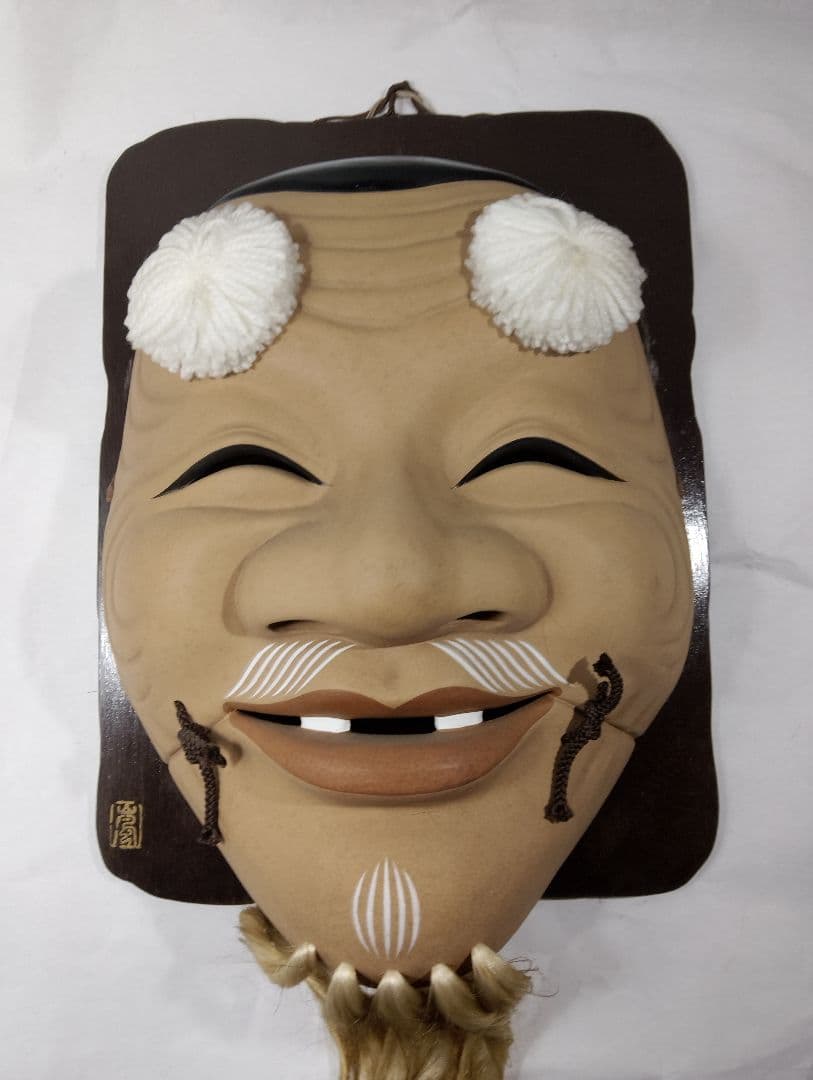 木製の笑顔のお面